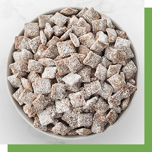 rice chex, corn chex and wheat chex cereal squares in a bowl to